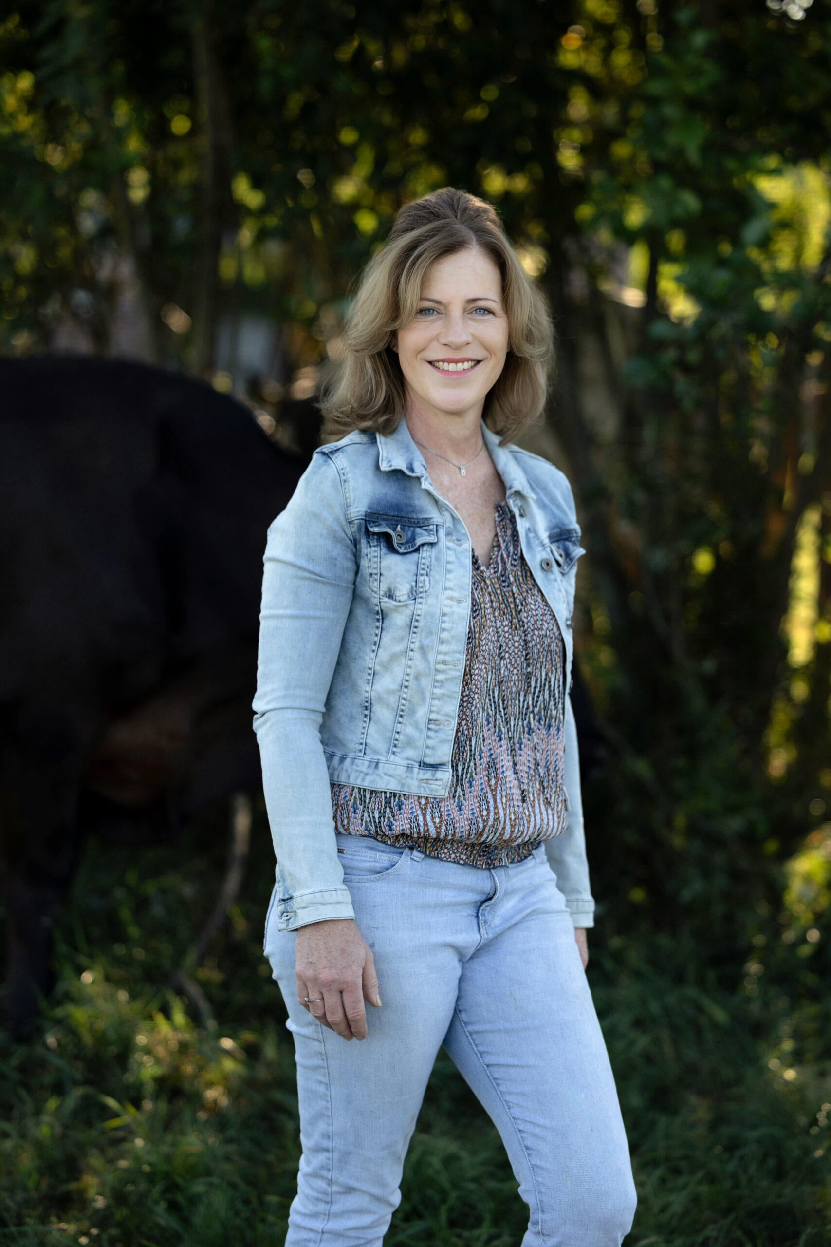 Outdoor branding portrait of Willeke at the farm