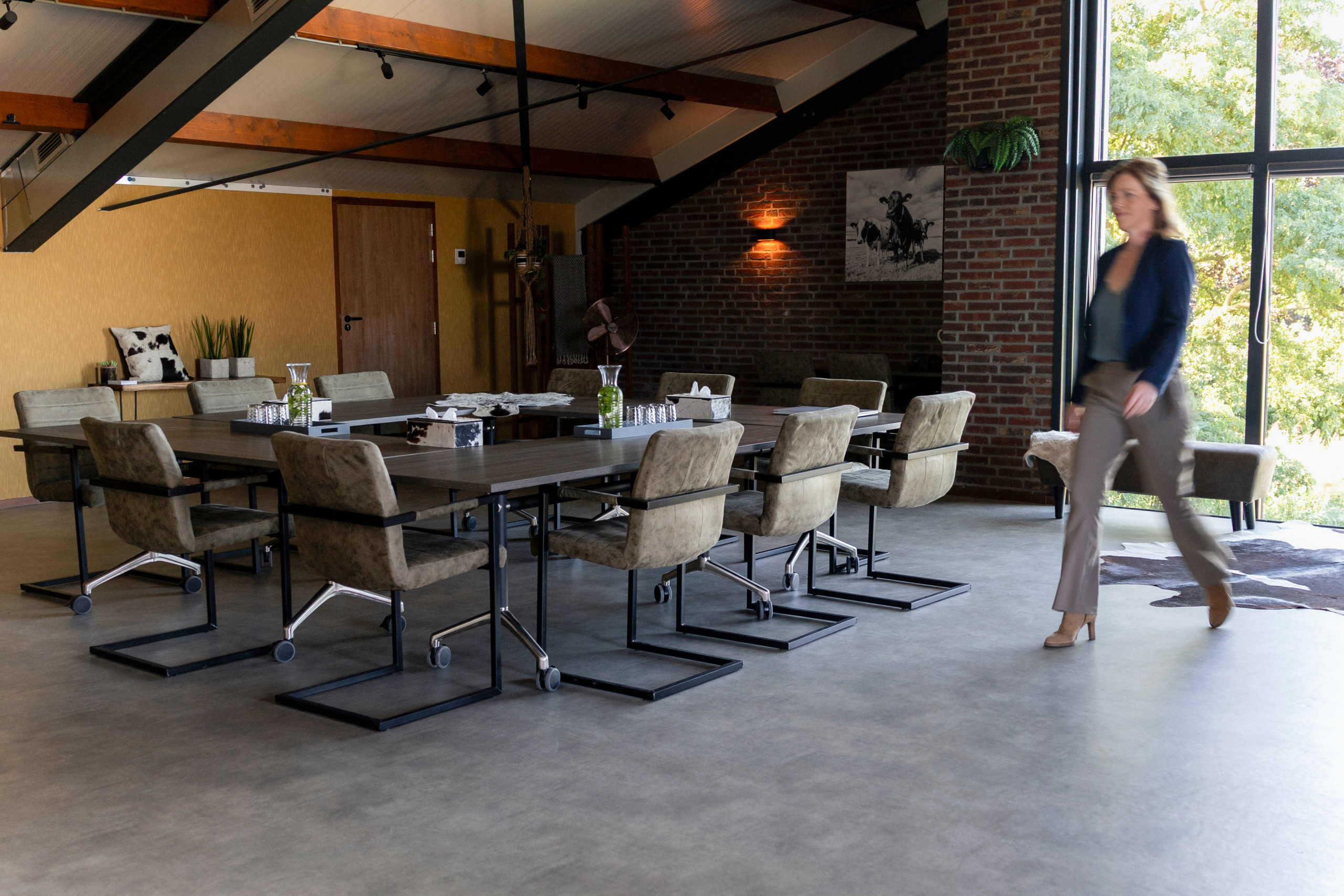 Willeke walking through the meeting space at Milk & Meetings